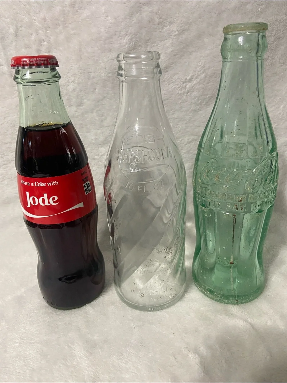 Coca Cola Trio of Clear, Green and Red Glass Bottles